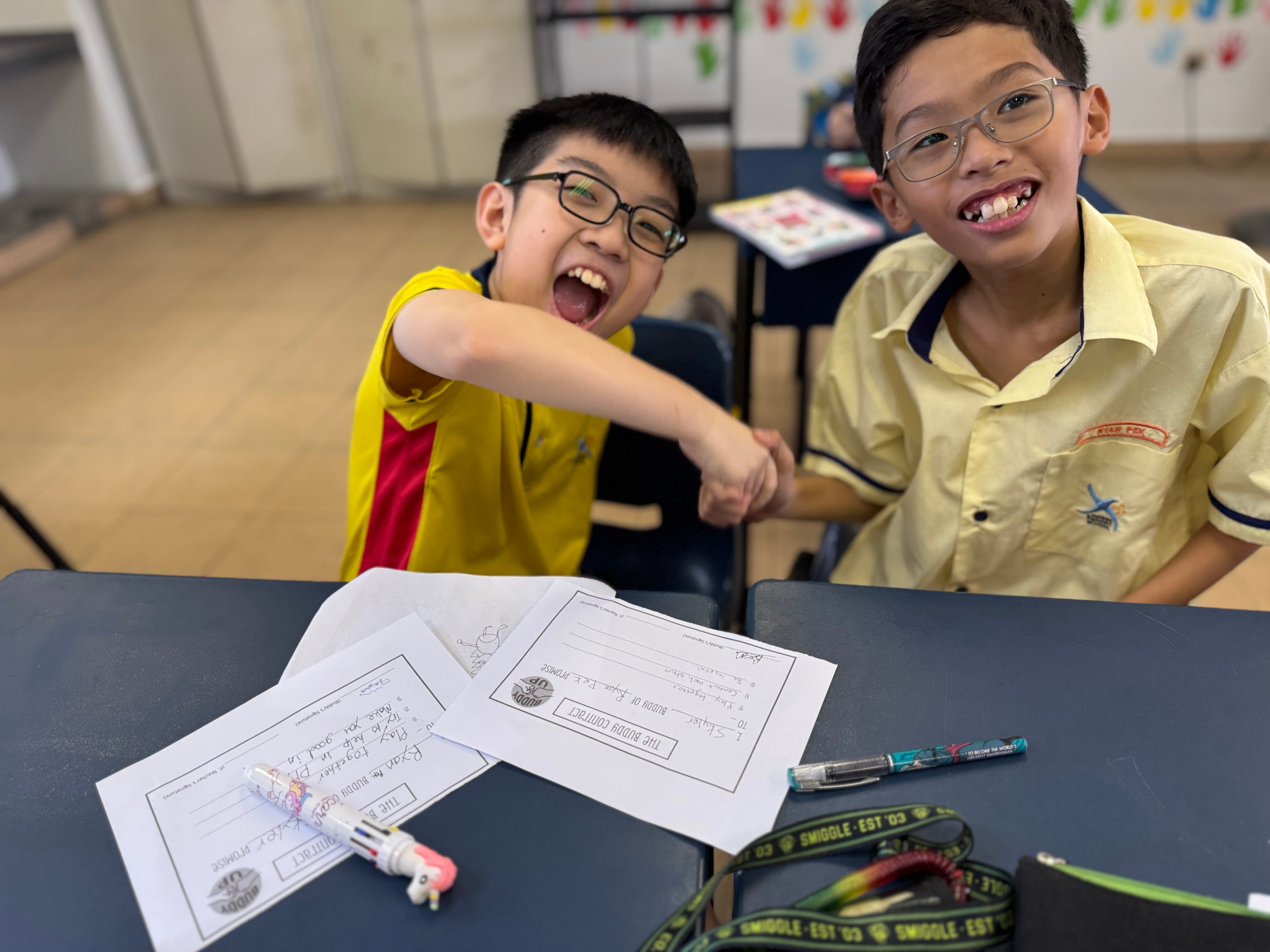 Peer buddies bonding through their creative handshake